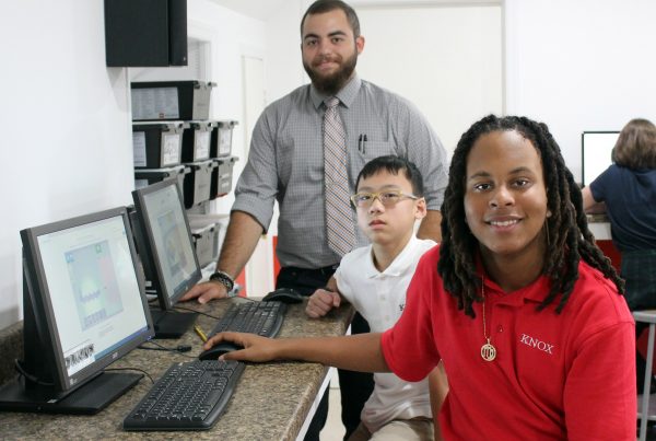 Image of STEM Teacher Angelo Mauro with two students