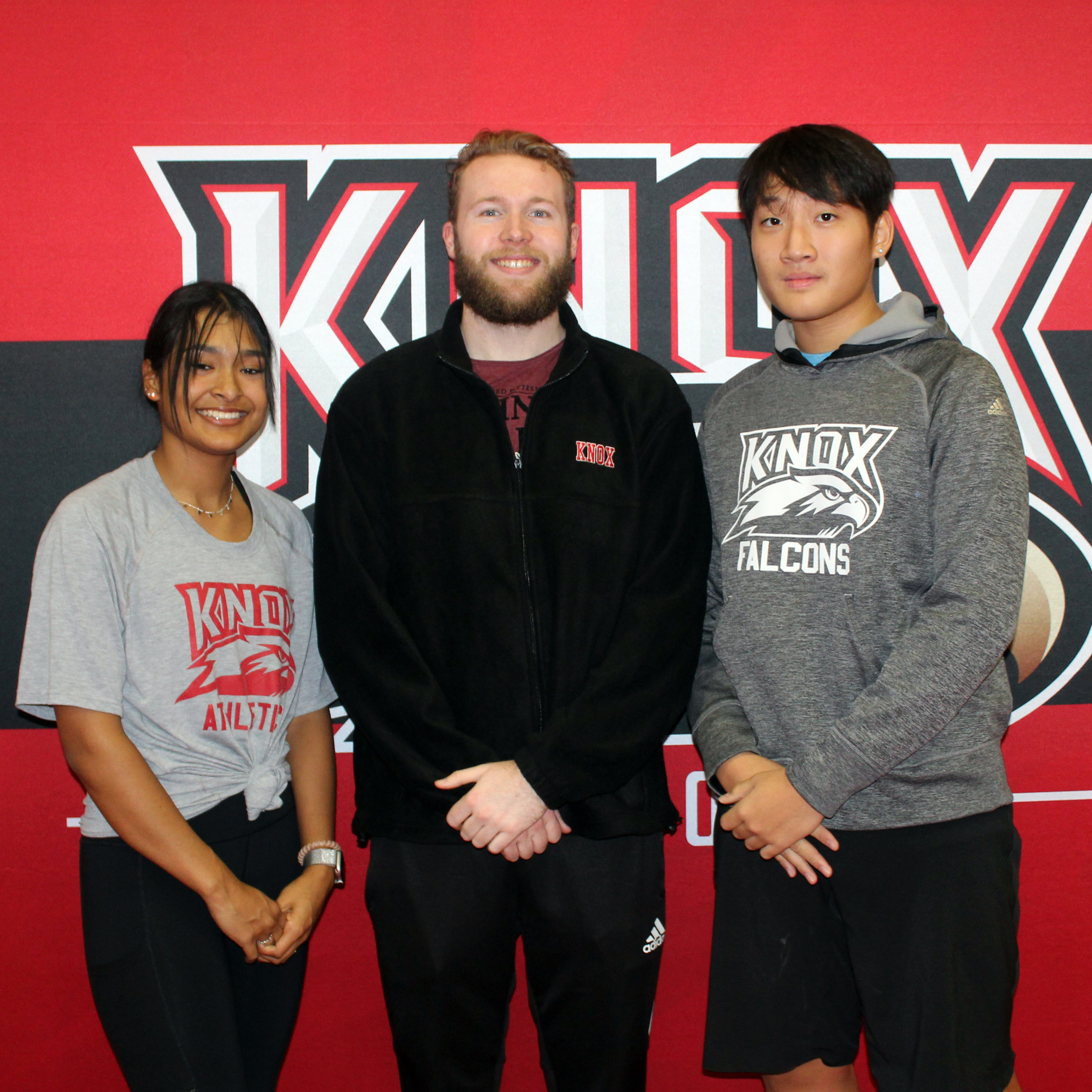 Image of Knox rowing coach and two student-athletes