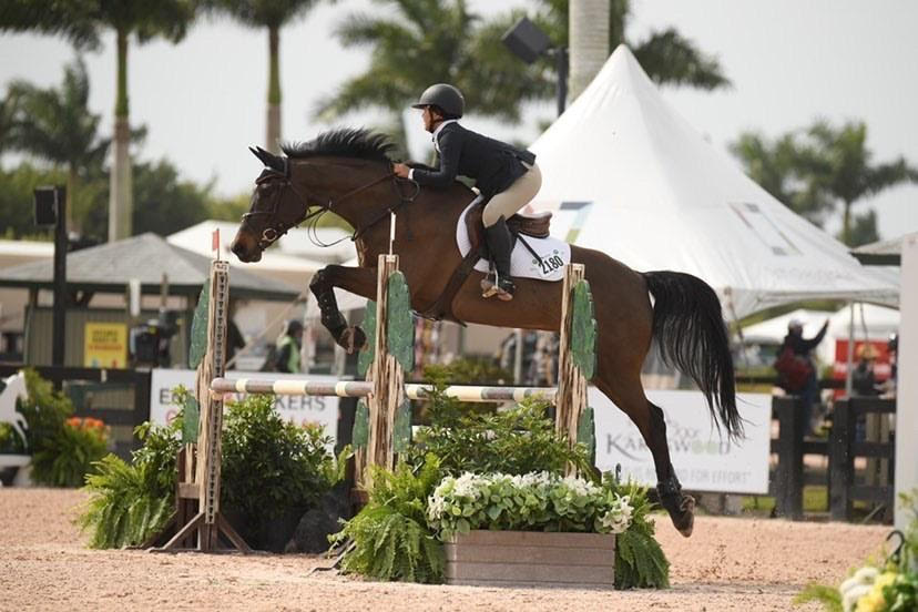 Image of Yvonne Xie jumping her horse