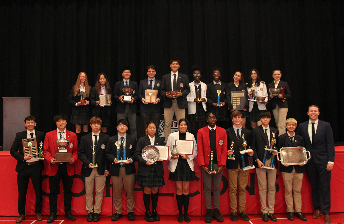 Students Holding Awards from Ceremony